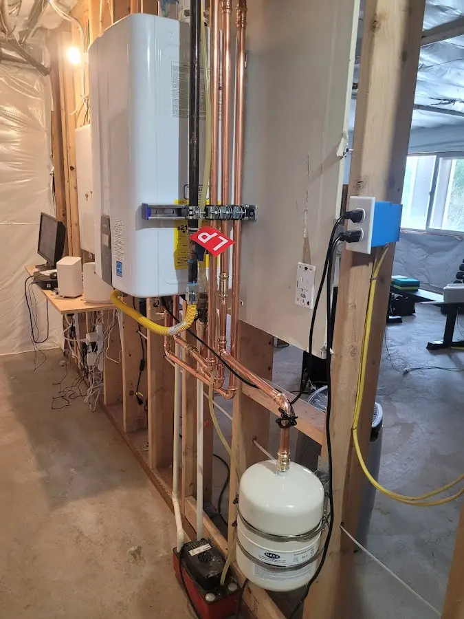 Licensed plumber repairing a kitchen sink in Belpre